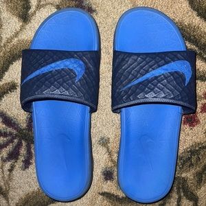 Blue Nike slides